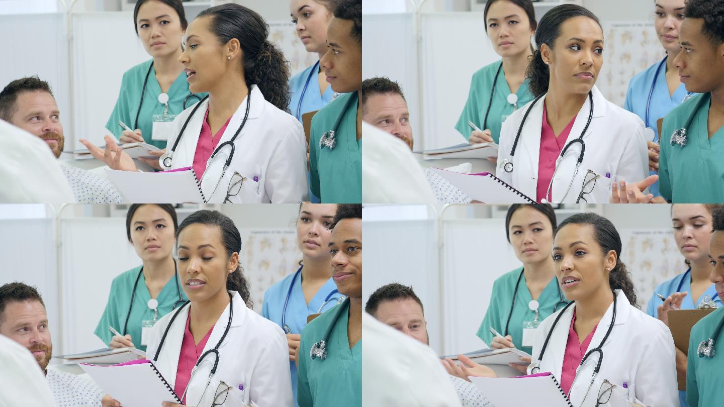 女实习医师在医院查房时讨论病人的诊断