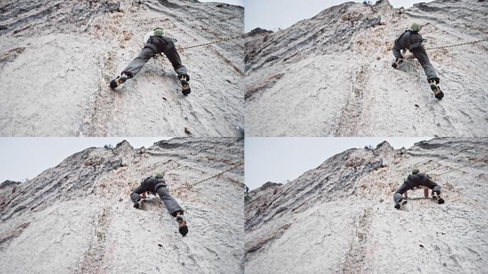 攀登悬崖的男性攀岩者