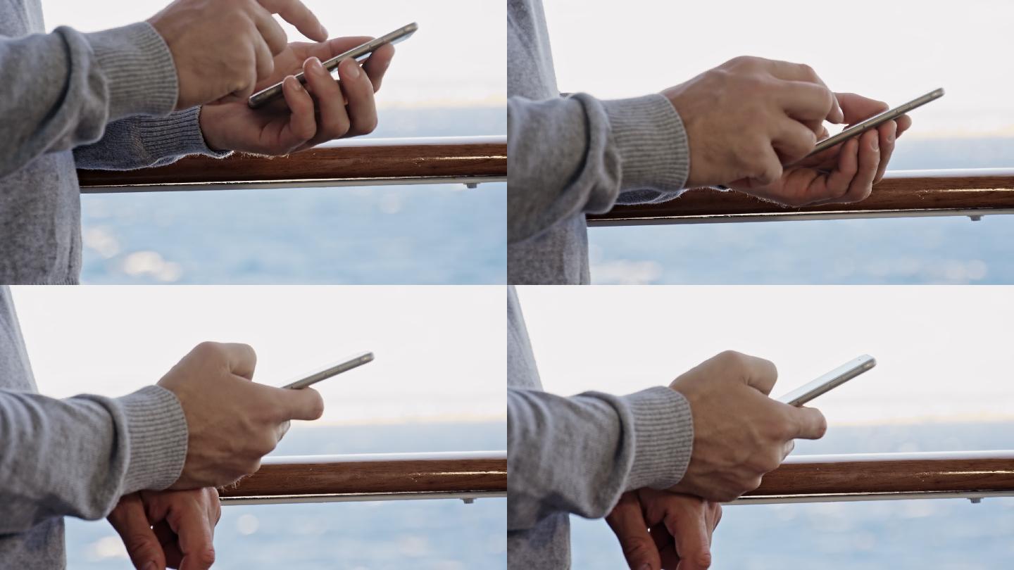 一个男人在船的甲板上用手机拍的特写镜头。