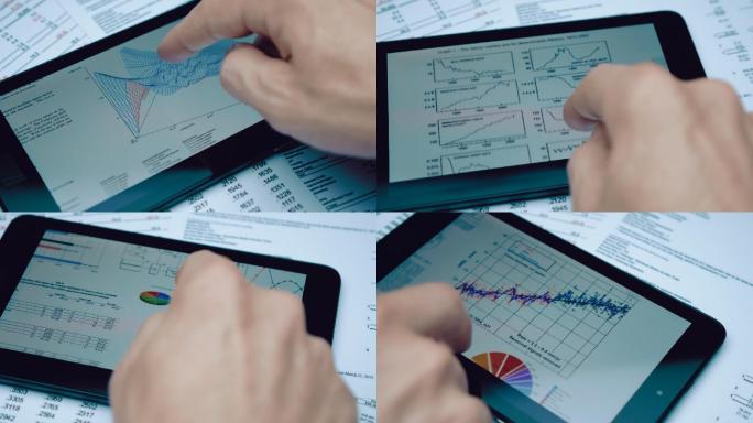 财务分析师可以在触摸板的屏幕上看到图表