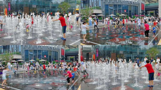 夏日喷泉中玩水的孩子们