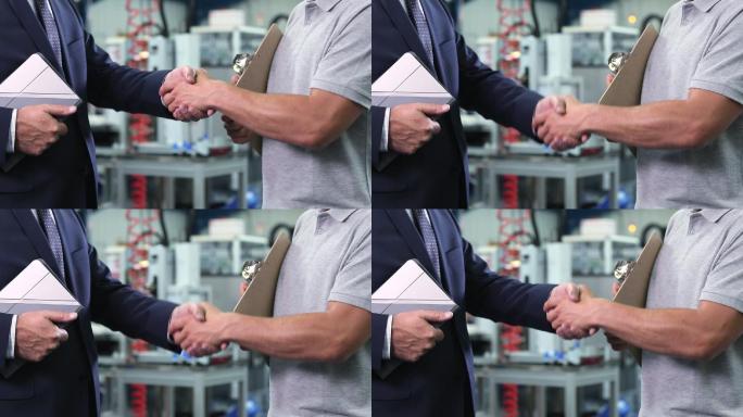 工厂老板与工程师握手的特写镜头