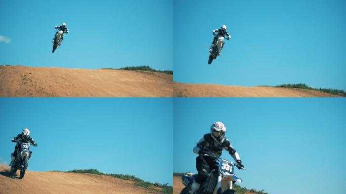 一个骑摩托车的人跨过尘土飞扬的地形