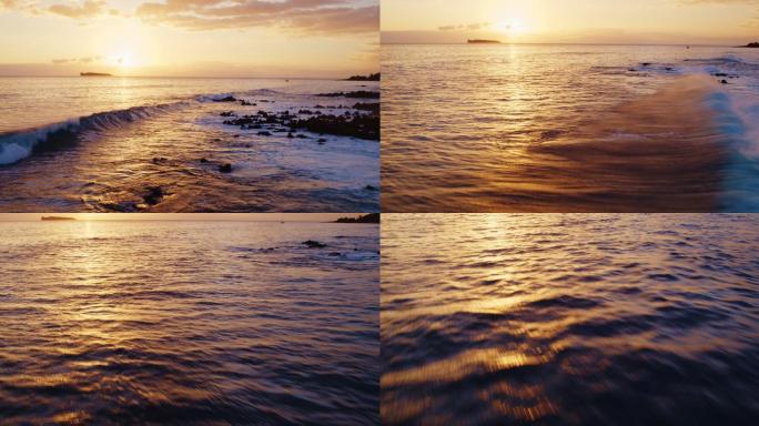 日落海浪和海洋鸟瞰图