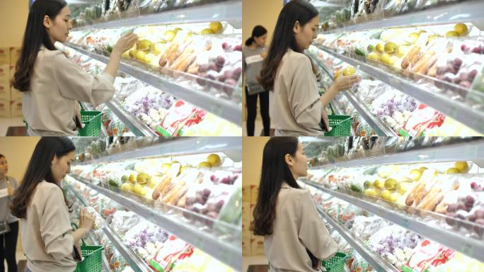 女人在超市买新鲜水果和蔬菜