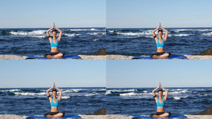 在海边的练习瑜伽的女人