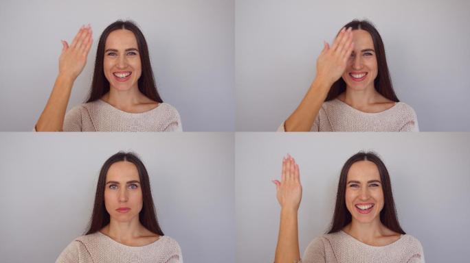 有趣的女人用一只手改变面部表情