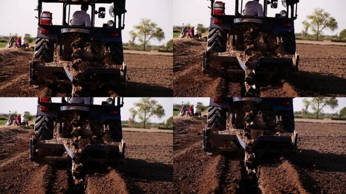 农民使用拖拉机和机器在田间进行钻探