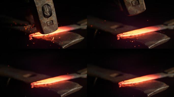 金属工人把一块热金属锻造成刀片。