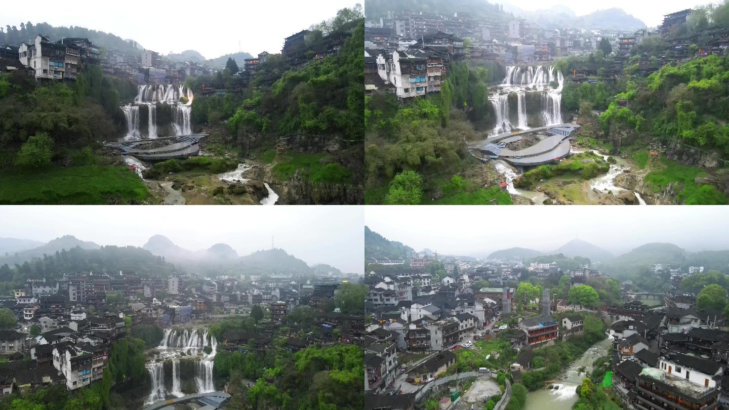 航拍挂在瀑布上的湘西芙蓉镇