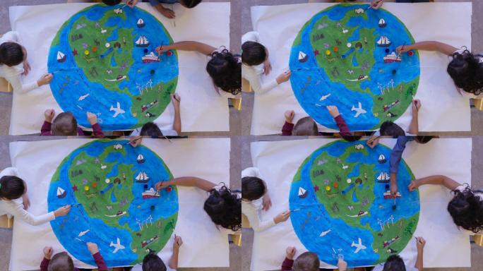 一群小学生一起画地球