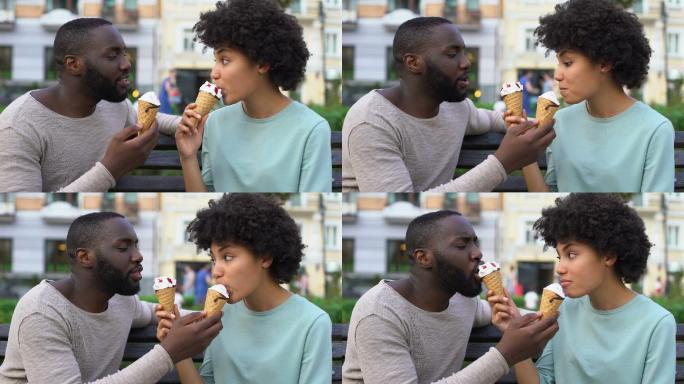 年轻情侣约会中分享冰激凌
