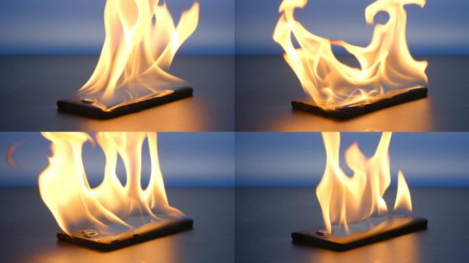 慢动作：智能手机在桌子上燃烧