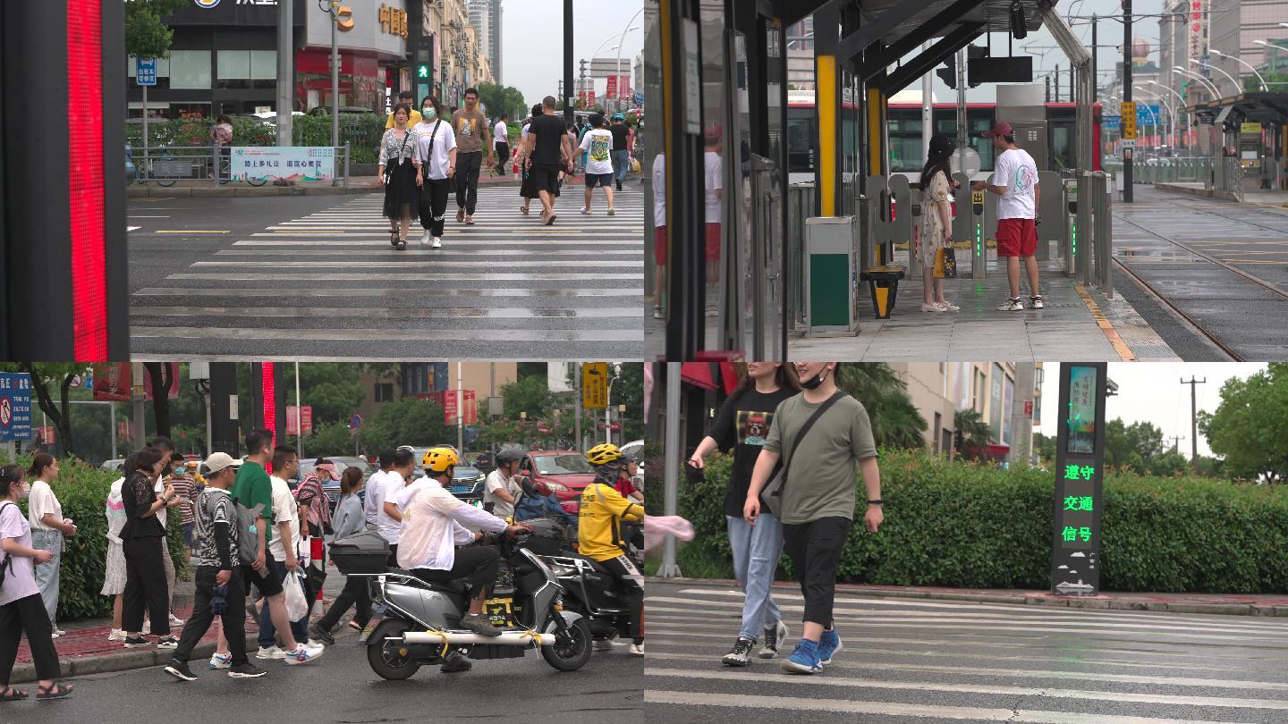 雨后街道人流过马路匆忙人群