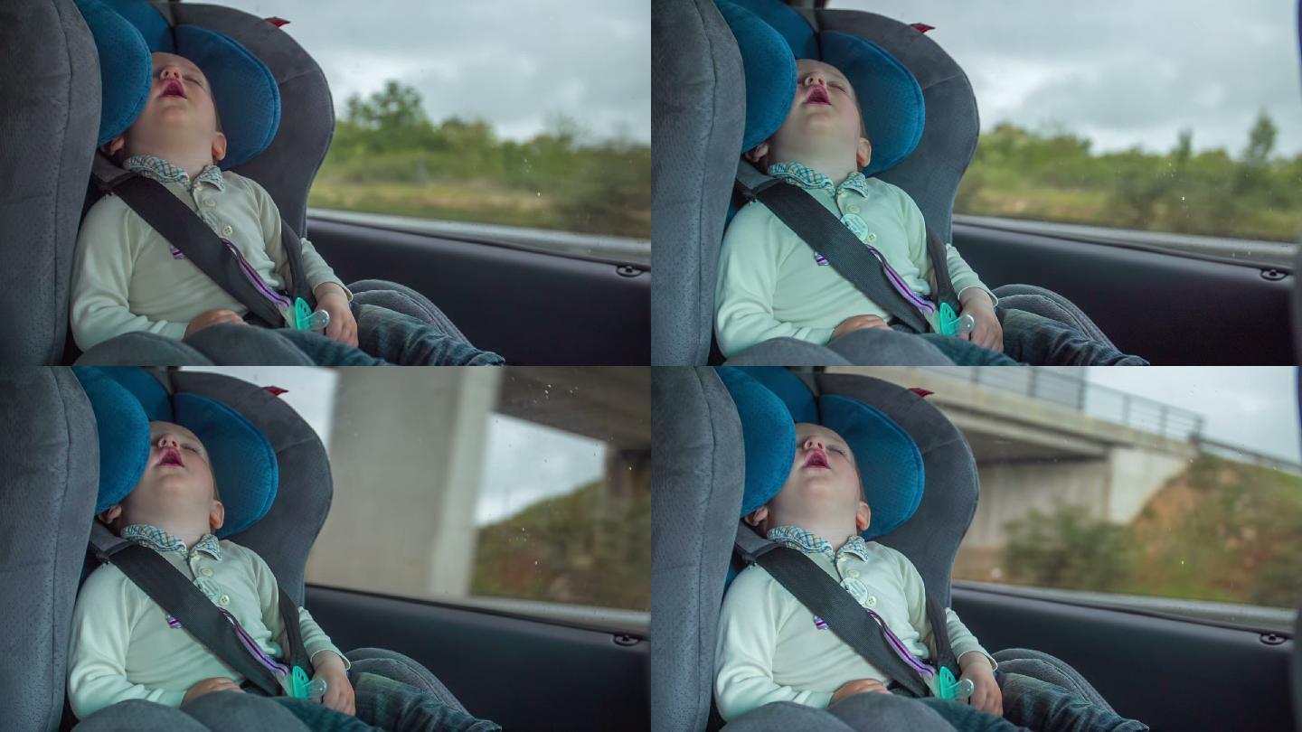 男孩睡在车里孩子车上睡着