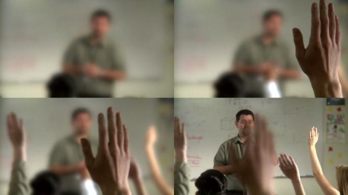 教师和班级，学生举手向老师提问。
