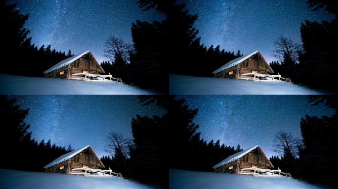 美丽的木屋在冬日的森林下繁星点点