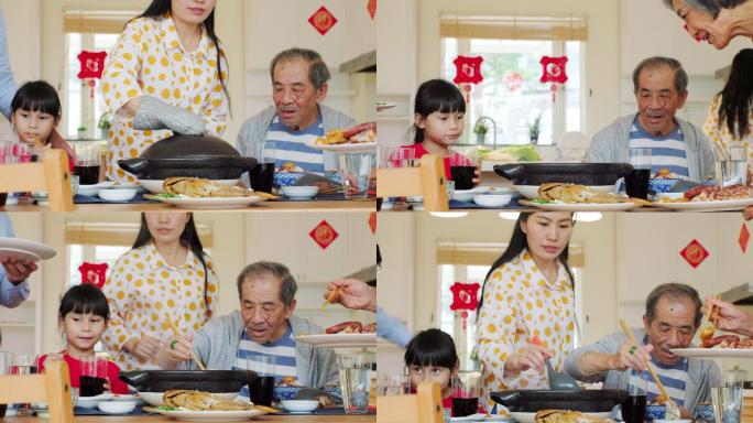 多代家庭在家中吃晚餐庆祝中国新年，年夜饭