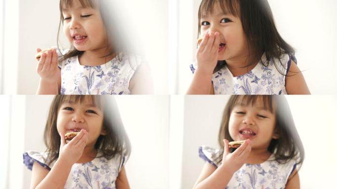 小女孩很喜欢吃饼干
