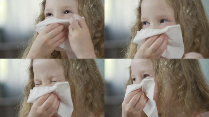 小女孩用餐巾擦鼻子的特写镜头