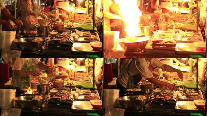 在泰国街头小贩流动餐厅做饭