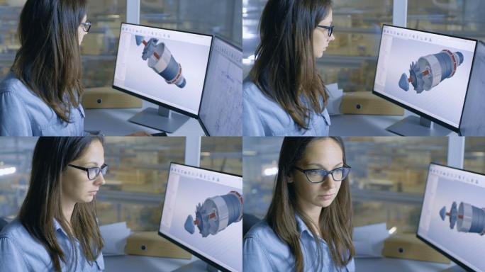 女工程师在她的电脑上用CAD软件做发动机