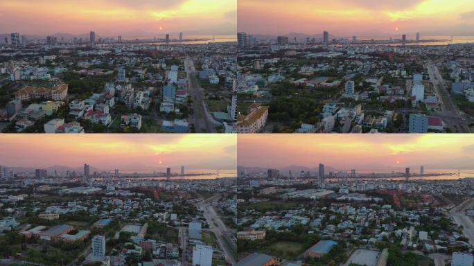 日落时分飞越越南岘港市区的鸟瞰图