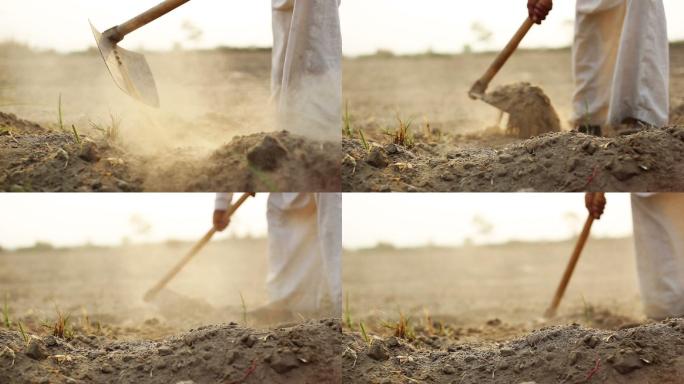 在挖泥土的农民