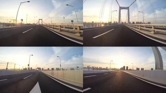 司机的视角朝向彩虹桥上的日出开去。