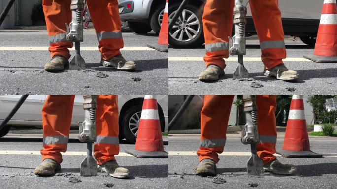 千斤顶锤钻破碎混凝土道路。