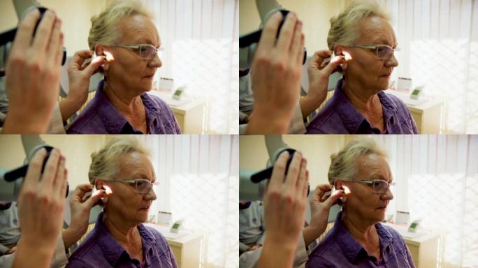 在听力科接受检查的老年妇女