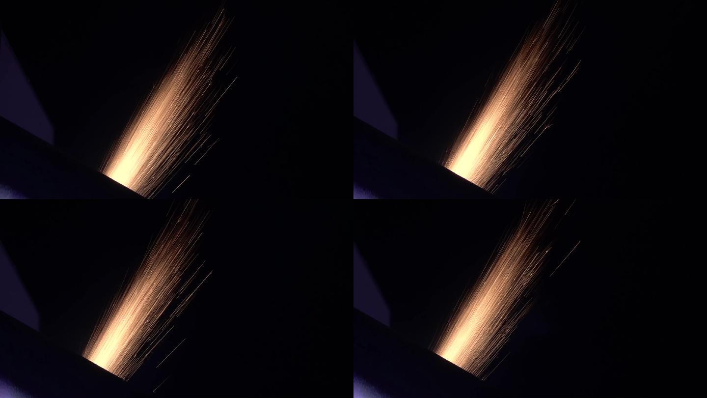 金属制品激光处理产生的黑色背景上的火花