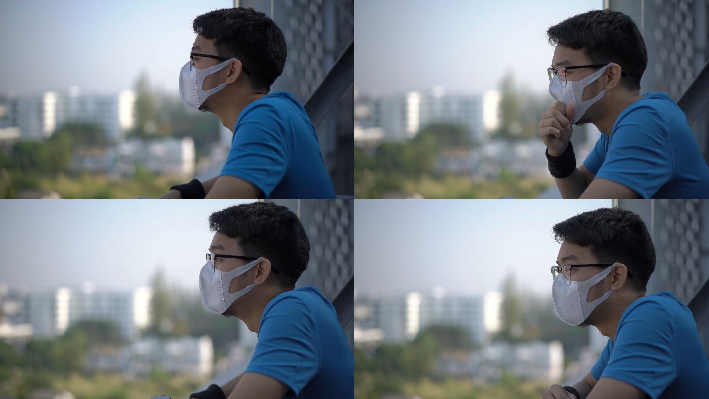 男子戴着空气污染口罩咳嗽