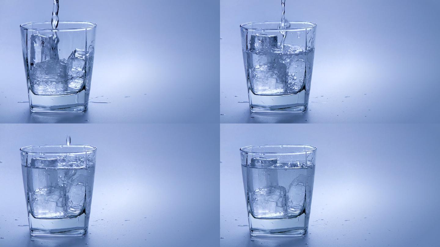 水倒进装有冰块的玻璃杯里