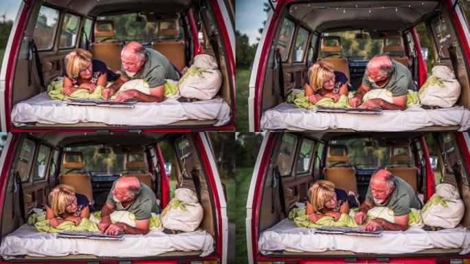 一对老年夫妇开着露营车在公路上旅行