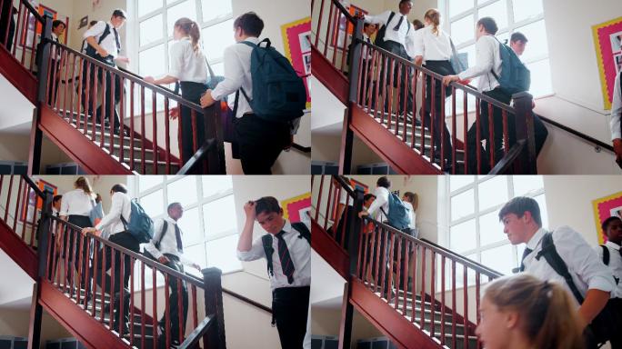 穿制服的青少年学生在课间走下楼梯