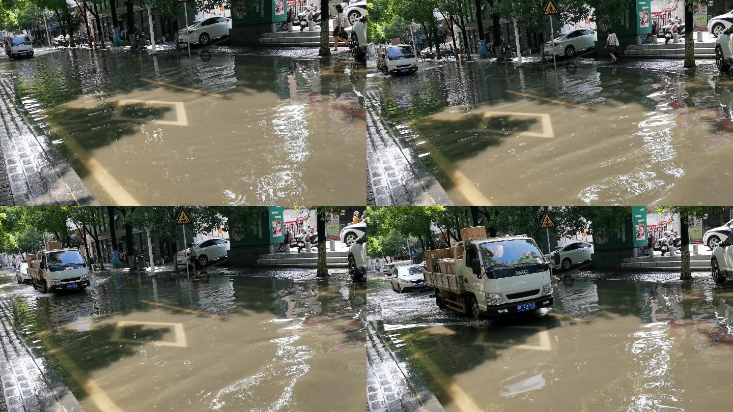 汽车驶过雨水积水的城市街道马路道路
