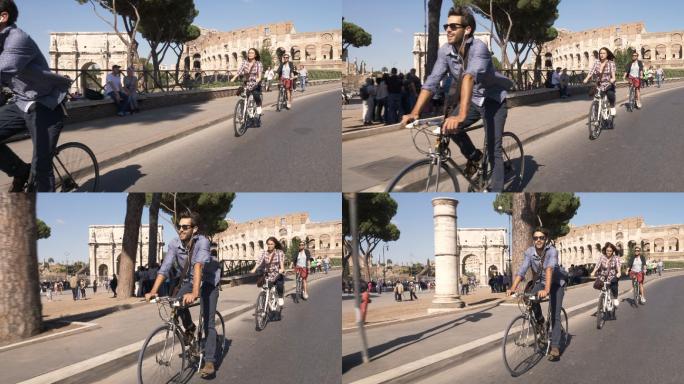三个游客在罗马斗兽场附近道路上骑自行车
