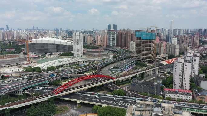 4K航拍上海体育馆繁华都市交通高架地铁