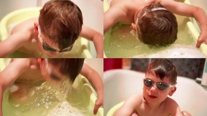 浴缸里戴着护目镜的小男孩