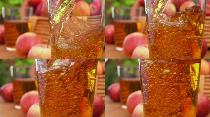苹果汁倒进玻璃杯里