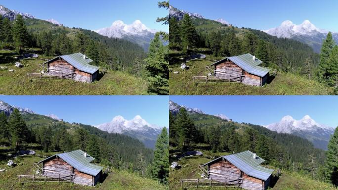 山间小屋航拍鸟瞰全景青山山脉山峰雪山