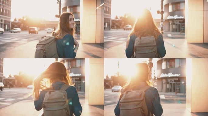 年轻的女人背着背包独自在市中心行走。