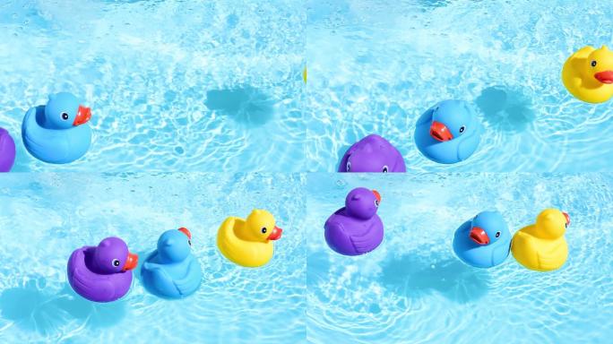 水里漂浮着三个玩具鸭子