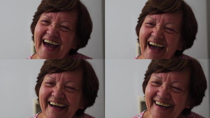 一个老年妇女正在大笑