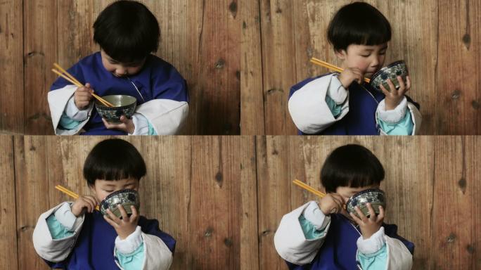 女孩学习用筷子吃饭