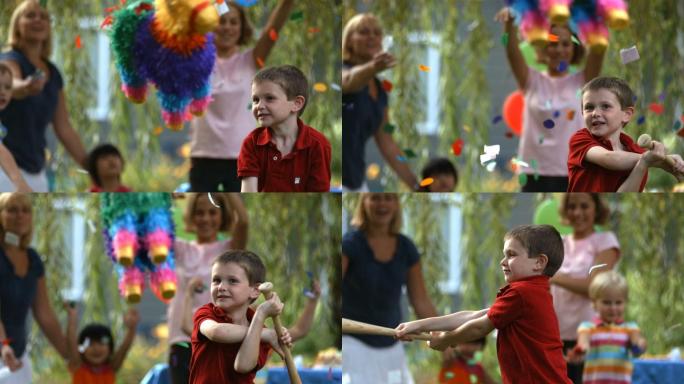 在派对上打皮纳塔的男孩的慢动作