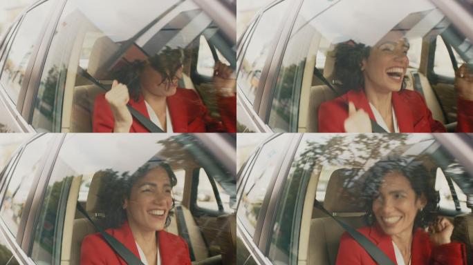 快乐的女人坐在汽车的副驾驶座上快乐地跳舞
