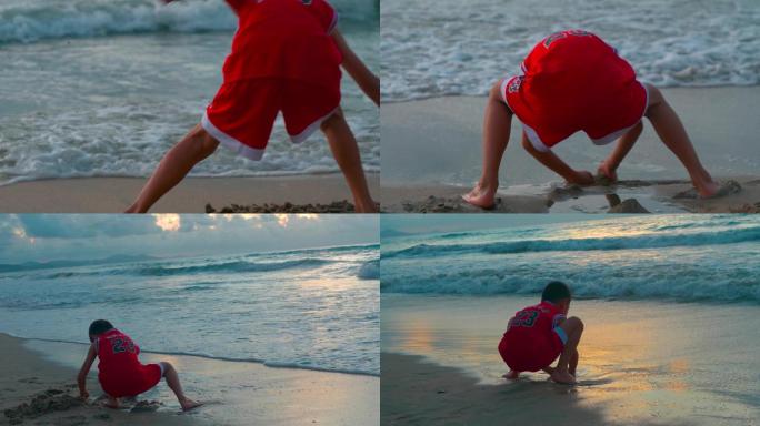 海边沙滩上玩沙子的孩子