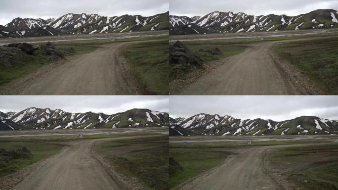 在通往冰岛高地的土路上驾驶越野车